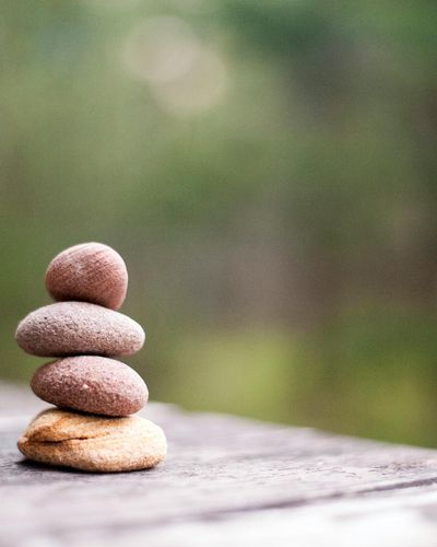 Minimalist stone stack symbolizing coordination and internal focus